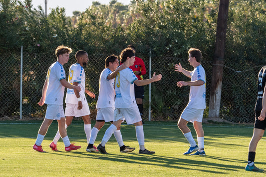 Long Beach FC players celebrate the game winning goal